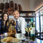 Managers of the Hinch Cafe, Harriet Finnigan and Darren Cosgrove, are pictured with puppy, Lola. Pic credit: Hinch Cafe,