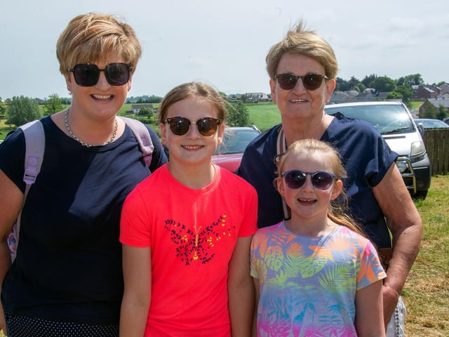 Well prepared for the bright sunshine at the Drumcree Parish Garden Fete on Saturday are from left, Karen Gordon and daughters, Emilee (11) and Annie (8) and nanny Barbara Hill. PT23-219.