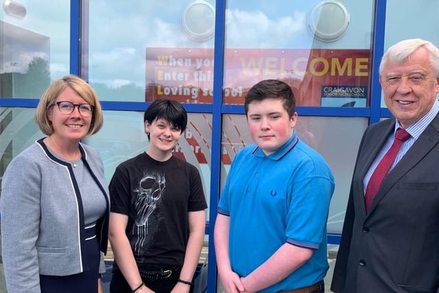 Principal Ruth Harkness and Mr B Mullholland, Chairperson of the Education Authority, celebrate with students Shakira McRoberts and Kody McGaffin.