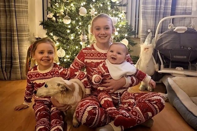 Kasper and his big sisters on his first Christmas.