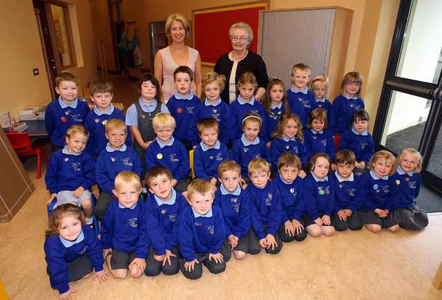 Downshire Primary School P1W class pictured with teacher Mrs Heather Wylie and Mrs Paddy Simpson in 2007