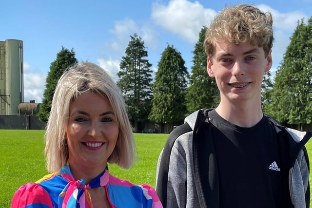 Dominic Bateson who received four A* and five A grades in his GCSE examinations is congratulated by principal Mrs Katrina Crilly.