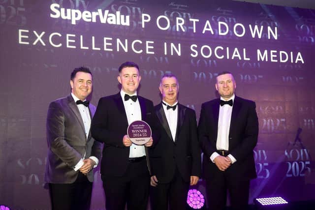 Peter Wilson, owner of SuperValu Portadown accepts the award for Excellence in Social Media. He is joined by awards host Pete Snodden, Mark Hewitt from category sponsor Dairy Consumer Foods and Musgrave NI Director of Marketing Desi Derby (right).