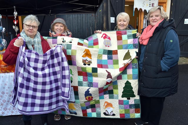 Showing off their patchwork at the Knitted Knockers of Northern Ireland Christmas market are from left, Maria Murray, Mary Garland, Rosaleen Markey and Catherine Wustrow. PT51-202.