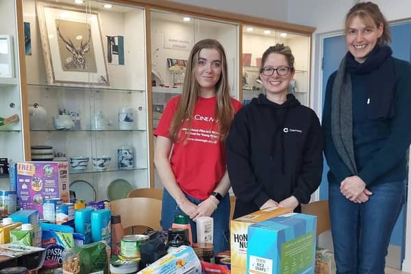 Claire Shaw, Press and Marketing Officer at Cinemagic, Jessica Pinder, Cinemagic Volunteer and Joanne McCracken, Causeway Foodbank pictured at Flowerfield Arts Centre. Credit Causeway Coast and Glens Borough Council