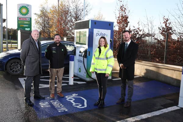 Stephen Hamilton (left) and Ron Whitten (right) from Henderson Group join Easton Boyd and Ailsa Wilkins from bp at one of the first of the new bp pulse Electric Vehicle charging points to be installed as part of the new network of ultra-fast and rapid chargers at around 100 bp and Henderson Retail sites in Northern Ireland. Picture: Darren Kidd / Press Eye
