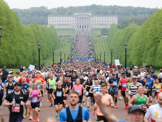 Participants in the Phoenix Energy Belfast City Marathon leaving the grounds of the Stormont Estate.