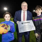 Councillor Jonathan Craig, Chair of the Communities and Wellbeing Committee pictured with representatives from Carryduff Colts FC and Carryduff GAA. Pic credit: LCCC