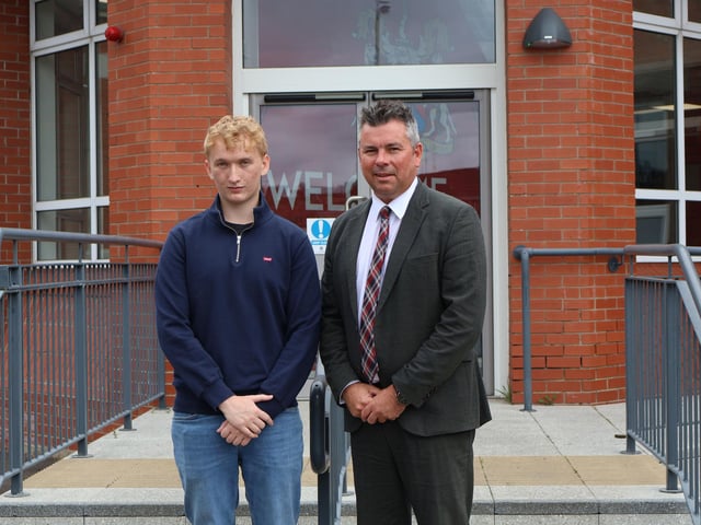 Rainey student who achieved 4 A Star A Grades pictured with the headmaster Mr Mark McCullough.