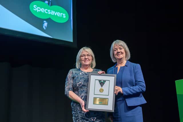 Deirdre Mcaree, representing Specsavers Larne, with Dame Mary Perkins.