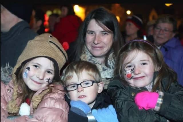 Katie, Harry and Roberta Murphy alongside Chloe Montgomery at the Ballyclare Christmas switch on event in 2013.