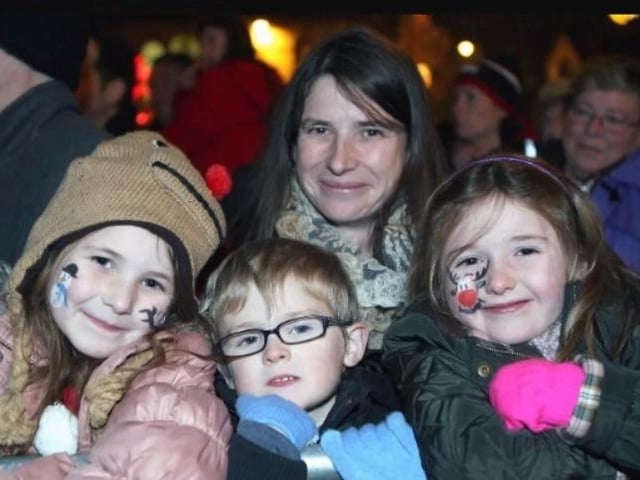 Katie, Harry and Roberta Murphy alongside Chloe Montgomery at the Ballyclare Christmas switch on event in 2013.