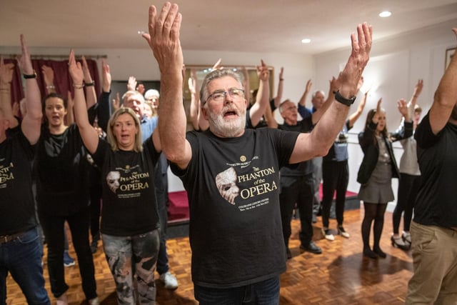 Feargal McCarry as Monsieur Firmin with the ensemble in rehearsal for Portrush Music Society's NI premiere of The Phantom of the Opera