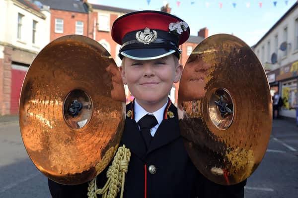 Harry McVicker (11) who plays the cymbals for Dunloy Accordion Band pictured before the start of the Portadown Thirteenth parade. PT28-300.