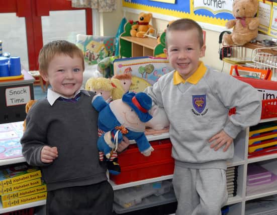 All smiles are new P1 pupils Justin Treanor and Thomas John McCann at the nursery rhyme table at Dickson Primary School in 2007.