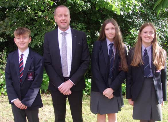 Form Prize winners Noah Weir, Ellie Warnock and Holly Reilly.  Photo: Larne Grammar School