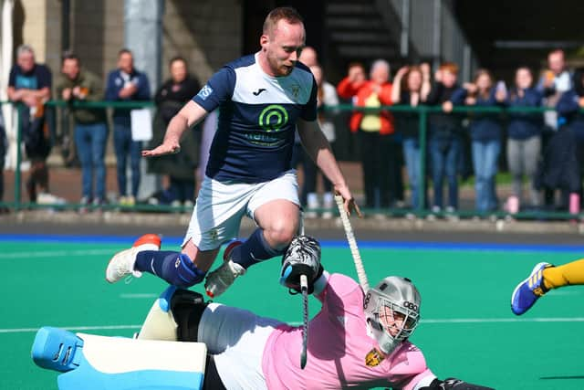 Portrush stopper Marc Bennett sends Saintfield’s Jack Taylor flying