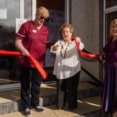 Olivia Nash performing the official opening of the Bluebell Café at Gillaroo Nursing Home in Larne with Nikki McCrudden, Gilaroo Nursing manager  and Jacqui McAllister,  Northern Regional College Health and Social Care lecturer.