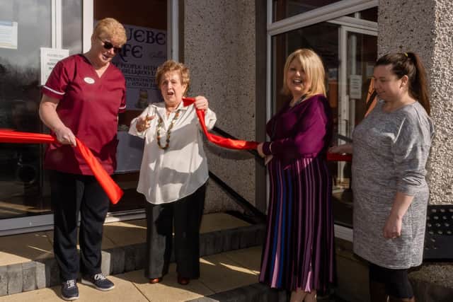 Olivia Nash performing the official opening of the Bluebell Café at Gillaroo Nursing Home in Larne with Nikki McCrudden, Gilaroo Nursing manager and Jacqui McAllister, Northern Regional College Health and Social Care lecturer.