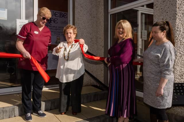 Olivia Nash performing the official opening of the Bluebell Café at Gillaroo Nursing Home in Larne with Nikki McCrudden, Gilaroo Nursing manager  and Jacqui McAllister,  Northern Regional College Health and Social Care lecturer.