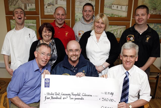 Johnny Wright, chairman of the Coleraine Liverpool Supporters Club, presents a £510 cheque which was raised during the club's quiz held in the Railway Arms in 2009 to Dr. Gilmore and Dr. Tracey for the Stroke Unit Causeway Hospital Coleraine. Included are Donna Hanna, Karen Hutchinson and Mark Dickson from the Unit, and club members Ricky Ferguson, assistant treasurer, Simon McIlreavey, club member and Unit staff, and Johnny Keys, assistant secretary