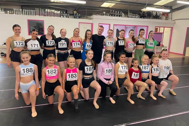 Sean Taaffe, Can You Dance? faculty member and a prominent figure in the dance industry is pictured with some of the 28 local dancers who have been selected as The Faces of CYD? Northern Ireland. Photo: Fiona Brown Communications