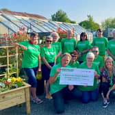 Pictured (L-R) in the front row are Andrew and his wife Carol along with Catherine King, Macmillan Move More Coordinator for Causeway Coast and Glens, supported by local Move More participants. Credit Macmillan Cancer Support