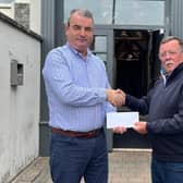Kevin McGivern of Harry’s Bar &amp; Kitchen, Banbridge presenting Paul O’Keefe with matchday sponsorship
