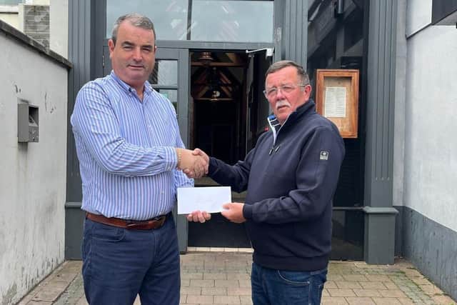 Kevin McGivern of Harry’s Bar & Kitchen, Banbridge presenting Paul O’Keefe with matchday sponsorship