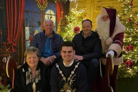 Santa is pictured with the Mayor of Lisburn & Castlereagh City Council, Councillor Kurtis Dickson, who officially declared Santa’s Grotto at Hillmount open. They are joined by the owners of Hillmount, Robin, Edith and Alan Mercer. Pic credit: Hillmount