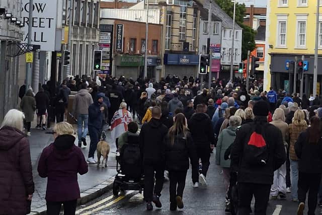 Crowds gather in Lisburn City Centre to protest following brutal knife attack in North Belfast. Pic credit: Gary Hynds