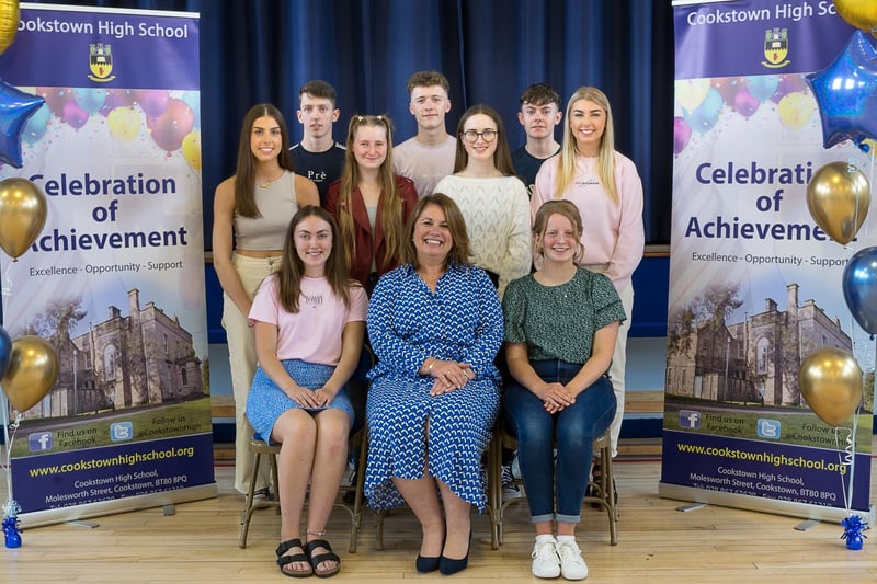 Pupils with three or more A grades at A2 Level pictured with the principal Ms Evans.