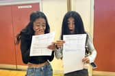 Two excited girls opening their results.