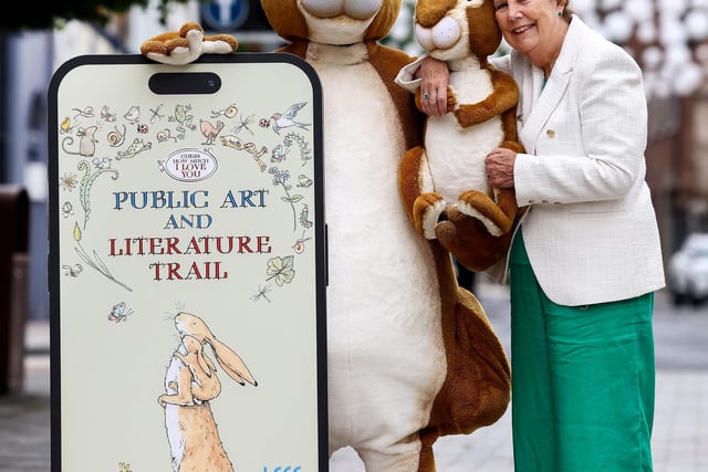 A much-loved children’s book by a local author is the inspiration behind an interactive public art and literature trail in Lisburn city centre. The Guess How Much I Love You-themed trail is free for the public to enjoy and can be accessed via a digital app or followed on a map collected from the local visitors’ centre in Lisburn. One version of the trail is suitable for ‘little hares’ and another for older children – but kids of all ages can develop their observational and navigational skills on this journey of discovery. They will collect 16 brass rubbings along the way: together they make up iconic imagery featured in the book. In addition to the interactive element of the project, a series of public artworks has been commissioned to help bring the book to life. A 4 foot high bronze sculpture of two hares, created by sculptor Trudy Burke will grace Castle Gardens. Dotted across the trails are wooden Nutbrown Hares and three hand carved benches by artists Charlie Haag, Matthew Crabbe and James Elliott which feature scenes inspired by Guess How Much I Love You.