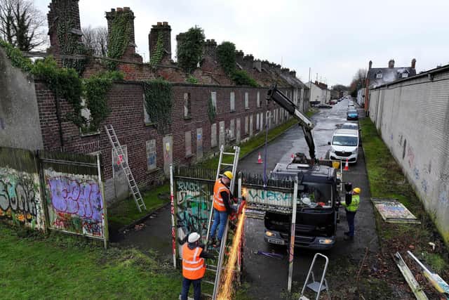 Contractors remove the interface at Water Street, Portadown. Picture: Michael Cooper
