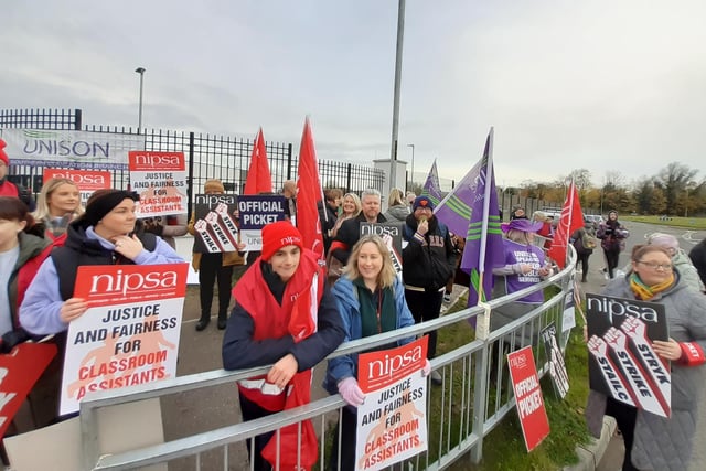 Justice and fairness for classroom assistants is the plea on placards outside Lismore College, Craigavon, Co Armagh.  Hundreds of school support staff from unions such as Unison, Unite, GMB and NIPSA joined the strike on the second day in what will be one of the biggest strikes among non-teaching unions in years. The ongoing industrial dispute is over the failure to deliver a pay and grading review to education workers as part of a negotiated resolution of the 2022 pay dispute.