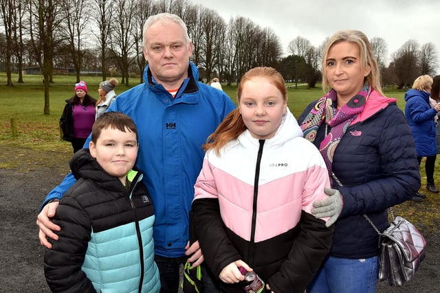 Colin McNally, cousin of Natalie, pictured with his family at the vigil in Lurgan Park, including twins Shea and Shannon (10) and his partner Jo. LM05-200.