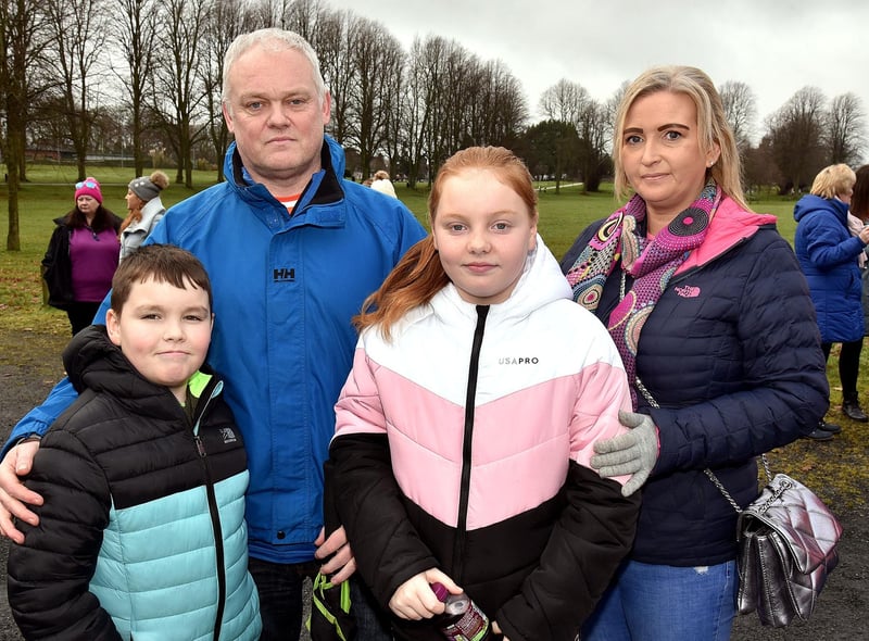 Colin McNally, cousin of Natalie, pictured with his family at the vigil in Lurgan Park, including twins Shea and Shannon (10) and his partner Jo. LM05-200.