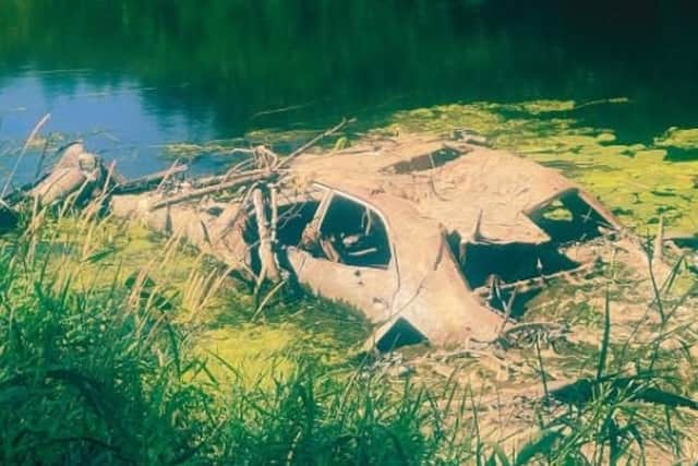 The Green Party has called on Lisburn and Castlereagh City Council to remove the car from the River Lagan. Pic credit: Green Party Northern Ireland
