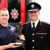 Jamie Kennedy, from Clady, who was awarded the Breathing Apparatus Award which is awarded to the trainee who has excelled throughout the BA Course, with NIFRS interim Chief Fire & Rescue Officer Andy Hearn.