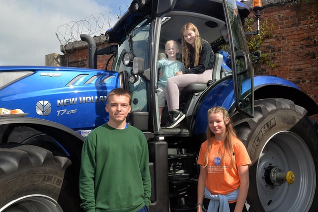 Admiring the big blue tractor at the Portadown First Presbyterian Church fun day are from left, Aaron Kent, Elijah McMenemy (4), Grace Forde and Lucy Finlay. PT36-223.