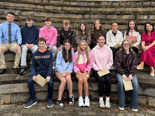 Selection of students who achieved 9 A star to A grades with Mr McCorley, head of Year 12 and Mrs O'Neill, principal.