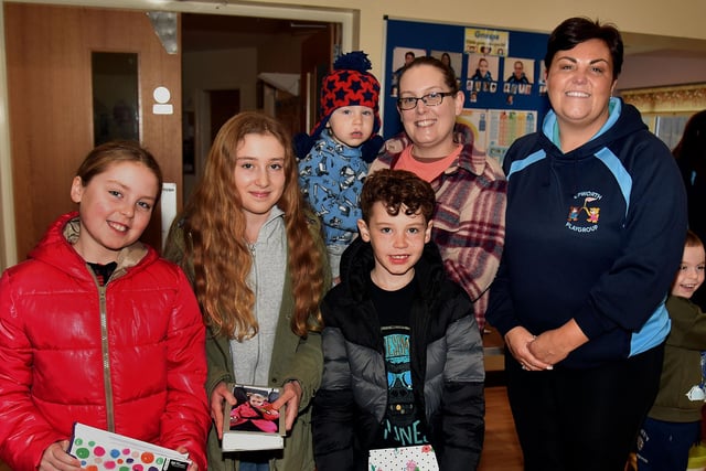 Epworth Playgroup leader, Stephanie Cardwell, right, catches up with past pupils at the group's 10th anniversary coffee morning. Included are the Jackson family from left, Hannah (10), Martha (12), Noah (2), Jonah (7) and mum Grace. PT48-234.