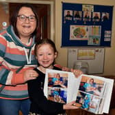 Showing off her photo record of her time at the playgroup is past pupil Sophie Elliott and her mum, Wendy. PT48-235.