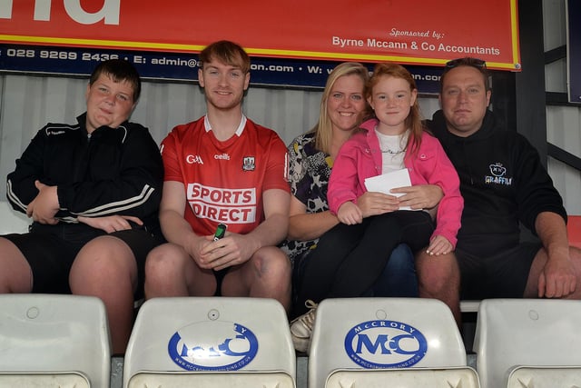 The Hirst Family picked a grandstand spot to enjoy the charity football match in aid of Just A Chat at Knockcramer Park on Sunday. Included are from left, Matthew, Michael, mum, Laura, Cassie (7) and dad, Chris. LM32-203.