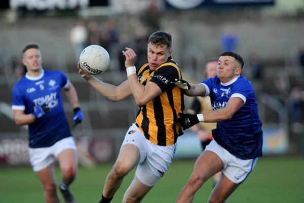 Crossmaglen's Oisin O'Neill drives past Clan's Michael McConville