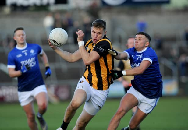 Crossmaglen's Oisin O'Neill drives past Clan's Michael McConville