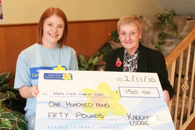 Jenay Doyle of Marie Curie Cancer Care receives £150 from Liz Dalzell of the Knockagh Lodge, the money was the proceeds from the hotel's wishing well in 2010.