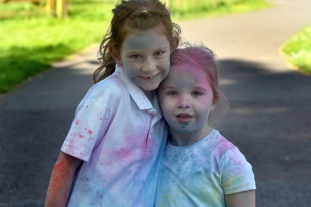 A couple of the Ballyoran Primary School pupils who enjoyed the fun and sun at the school charity fun run which was organised in conjunction with Healthy Kidz. PT21-212.