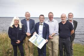 Agriculture, Environment and Rural Affairs Minister Andrew Muir pictured with a range of stakeholders on the shores of Lough Neagh where they discussed the new Lough Neagh Report and Action Plan. CREDIT BRIAN THOMPSON
